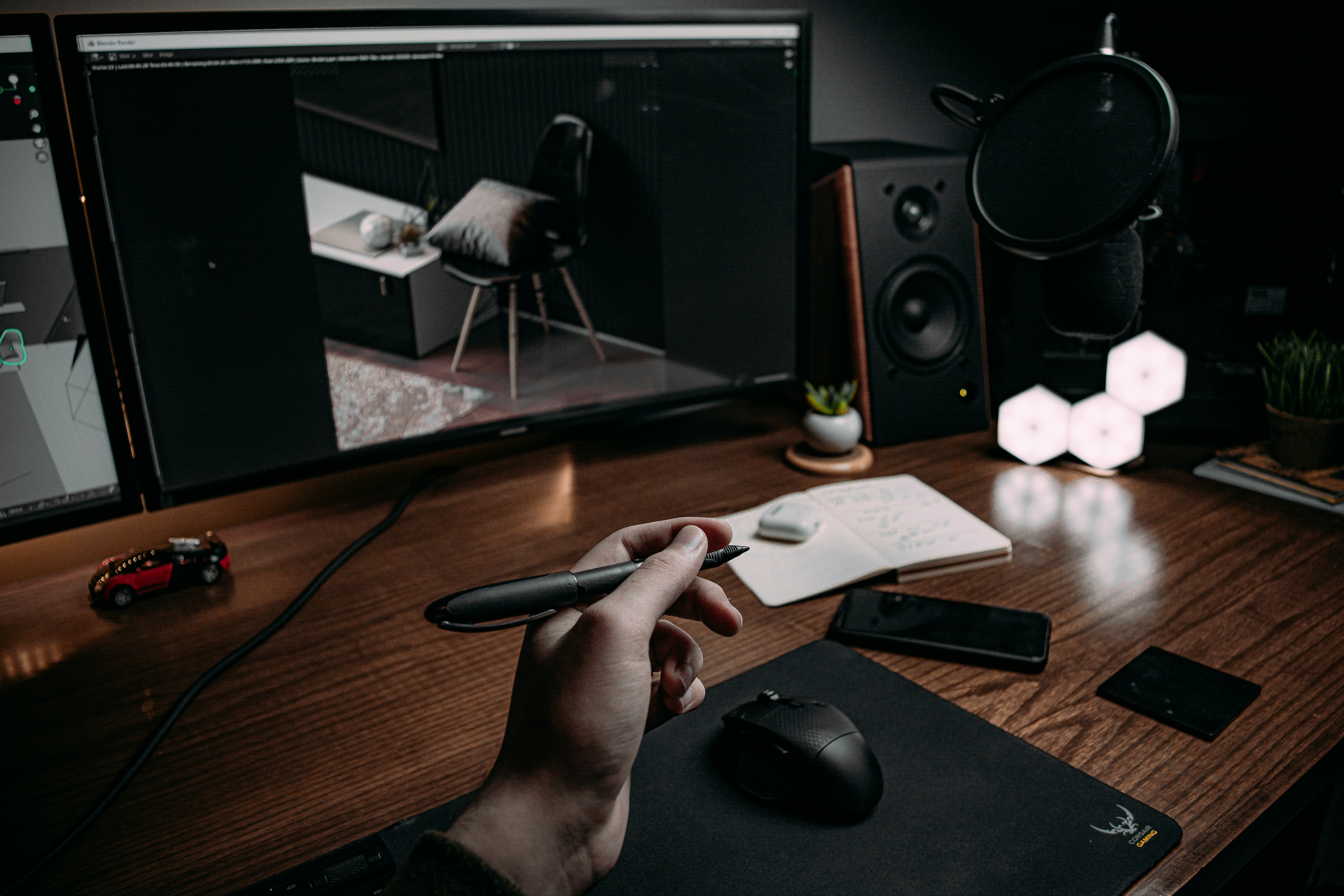 person holding black corded computer mouse